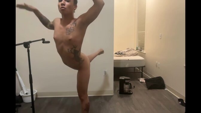 Naked ballerina practices her ballet moves in front of the camera 