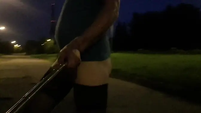 Naked beauty struts in sexy lingerie on outdoor walk