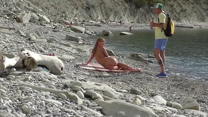 Naked Russian girl sucks blogger's big cock at nude beach
