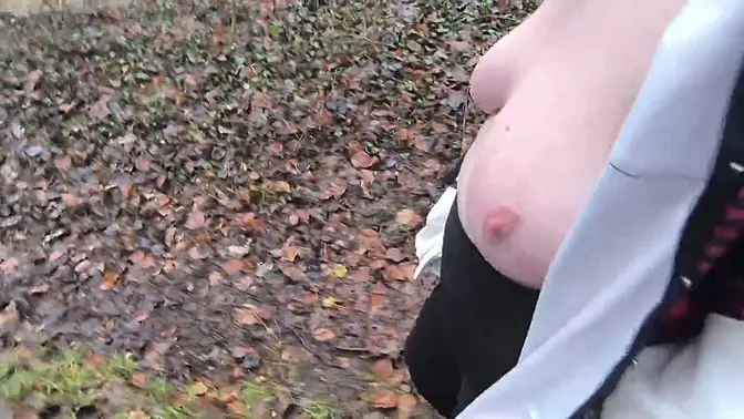 Naked woman gets her big tits slapped with a whip while hiking