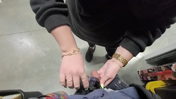 Naughty girl gives handjob to small cock in public storage