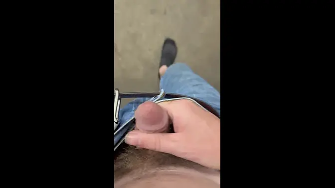 Naughty shop assistant teases with her feet and flashes her cock