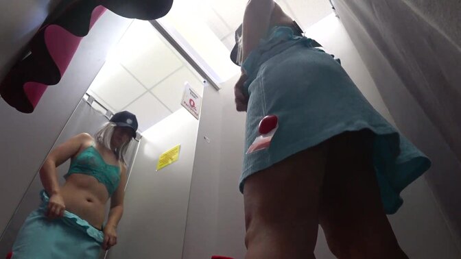 Peeping under a skirt with a hidden camera. Girl with beautiful booty undresses in the fitting room in a public store. The usual situation is more exciting than sex.