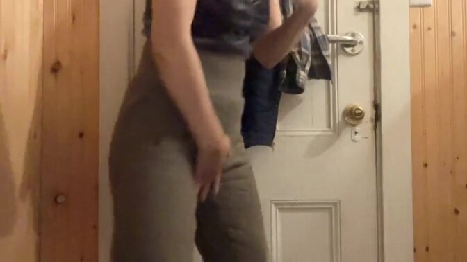 Petite Asian Hana cleans her pussy with a cup of water in the bathroom