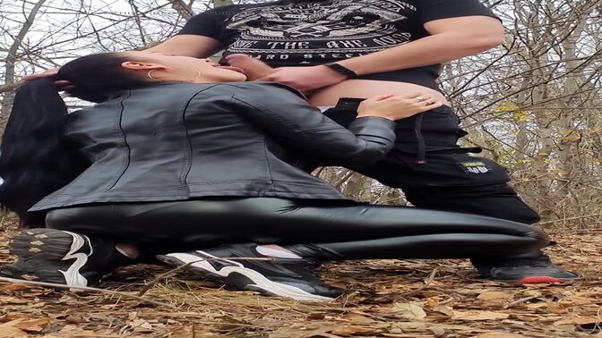 Ponytail girl in a leather outfit has a wild time sucking cock in the forest 