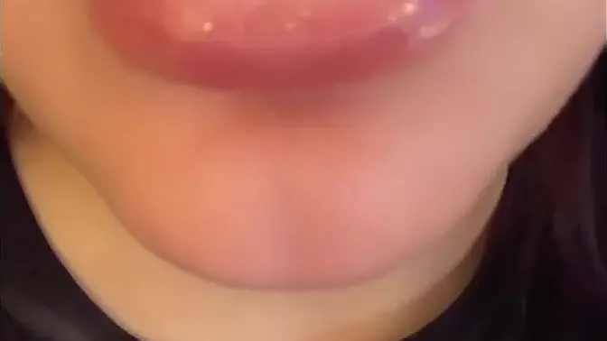 Pretty girl with big lips spits on cock