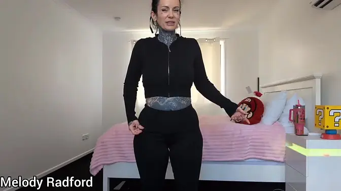 Pretty white MILF with big tits and fake boobs tries on haul in bedroom