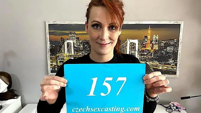 Red-haired babe nibbles on big cock while watching