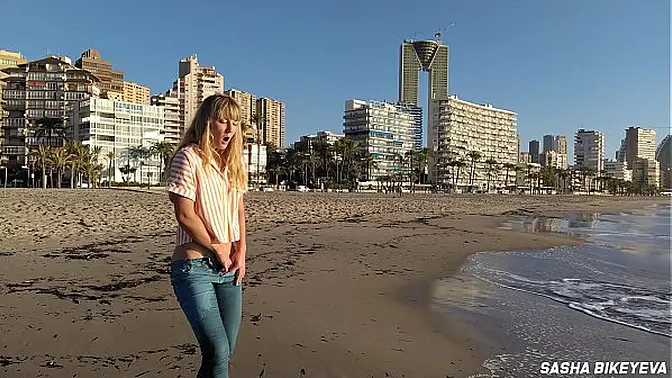 Risky masturbation on a public beach in Benidorm  Fetish Wet Sneakers  The girl pees beautifully in jeans  Fingering  Russian pornstar Sasha Bikeyeva