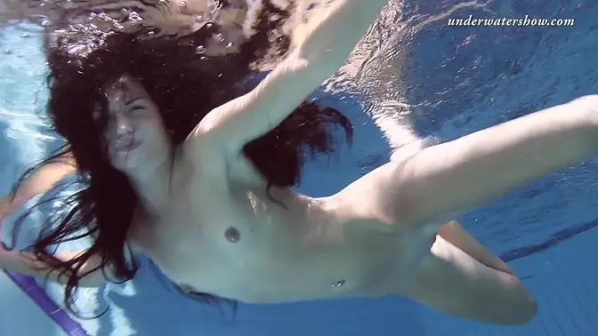 Russian nymphomaniac shows off her tight 18-year-old pussy and tits underwater