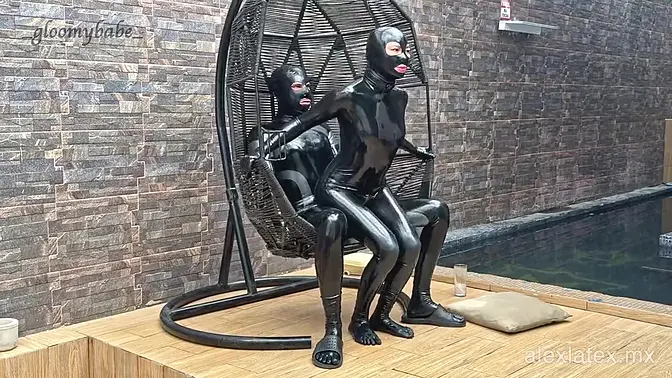 Sassy latex babe sucks cock by the pool