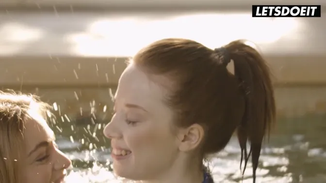 Sensual blonde and redhead French lesbians have poolside fun