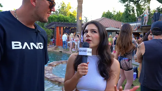 Sexy inked brunette competes and chats in bikini