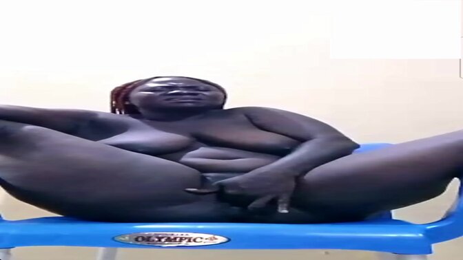 Shaved ebony babe mounts chair for a ride