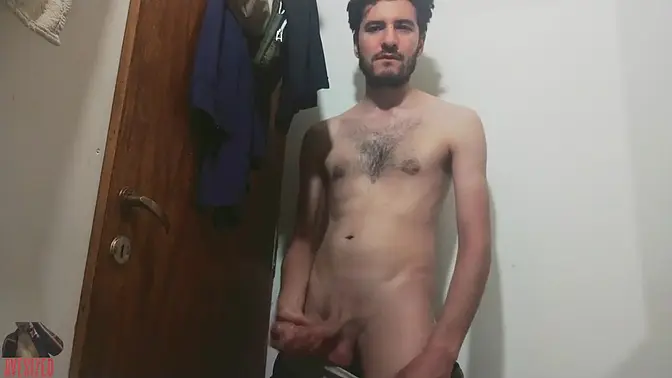 Skinny young man wanks his uncut big cock