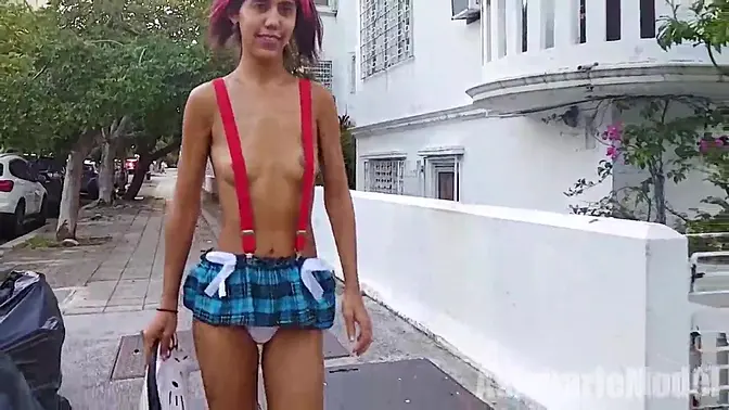 Sluttish Latina in micro skirt and suspenders flashes public
