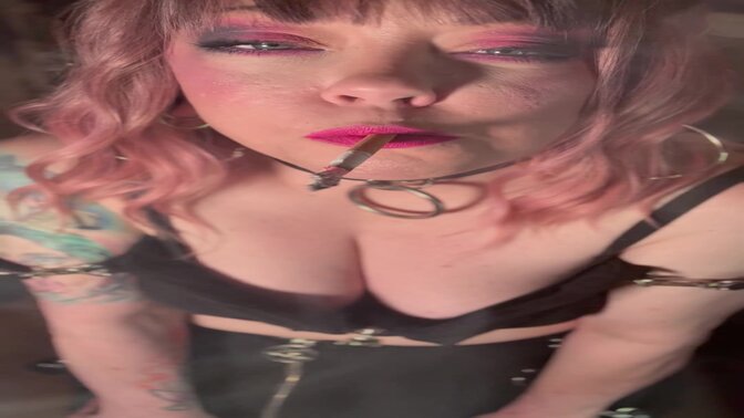 Smoking MILF Tina takes a drag and shows off her curves