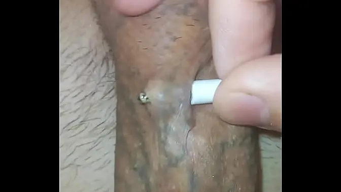 Solo twink shows off huge pierced cock