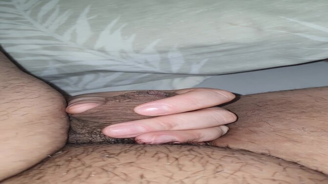 Step mom's hand slips into son's massive cock for a handjob