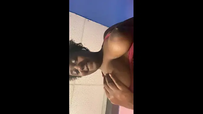 Sultry ebony babe plays with her big tits in sexy solo scene