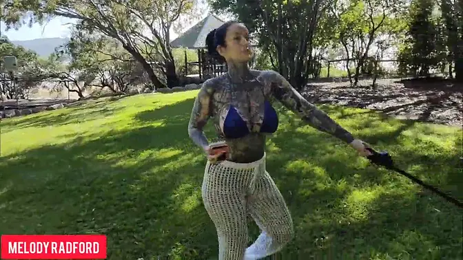 Sultry MILF walks in bikini on public beach