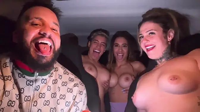 Tanned babe and her busty girlfriend suck each other in the car
