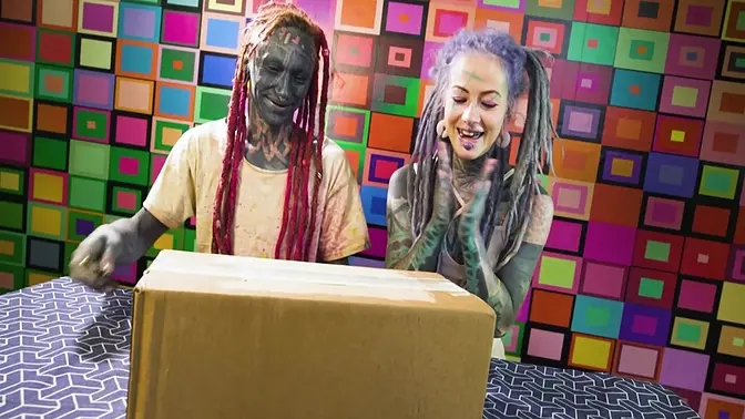 Tattooed couple plays with dildos and piercings