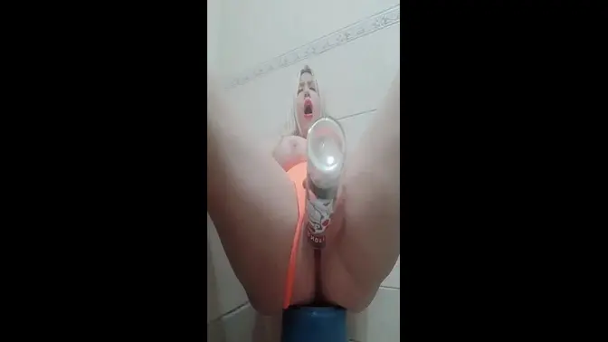 Teen beauty gets bottle of vodka in her pussy