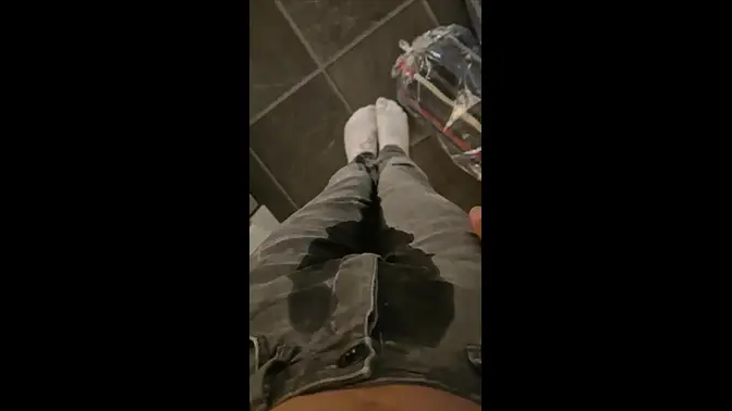Teen boy wets his pants while pissing himself