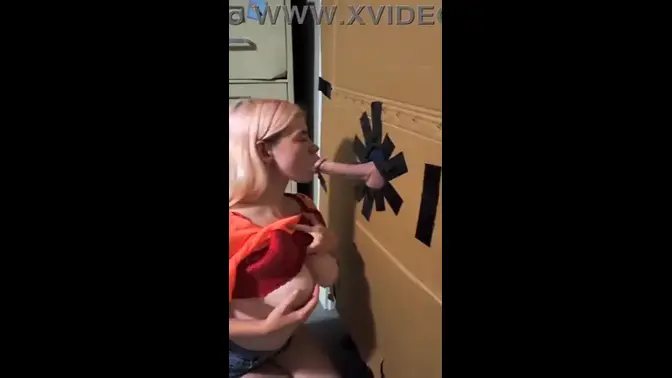 Teen slut sucks huge cock at the gloryhole