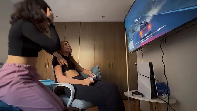 Teenage Latina girls explore each other's bodies in a girl-on-girl massage session