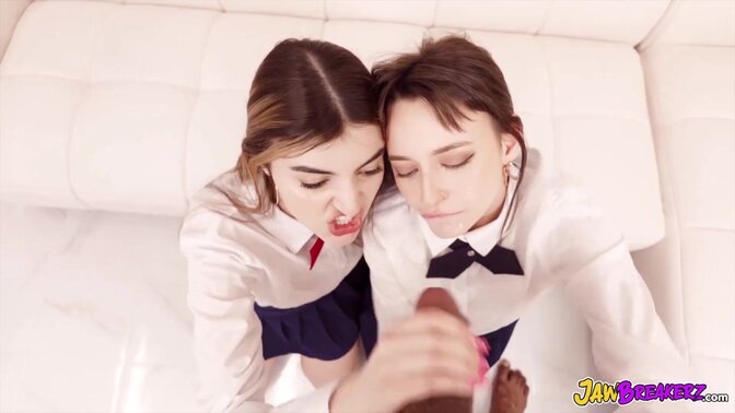 Two girls share a jawbreaker