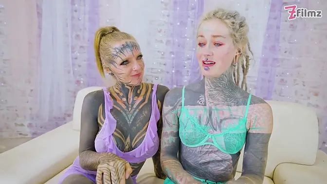 Two heavily tattooed teens show off their skills in a wild threesome