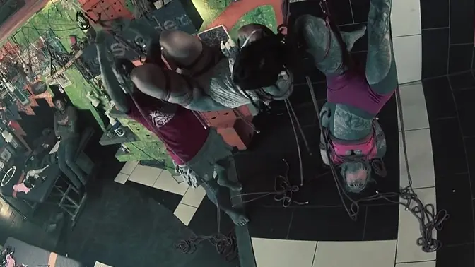 Two hot tattooed girls tied up in shibari bondage