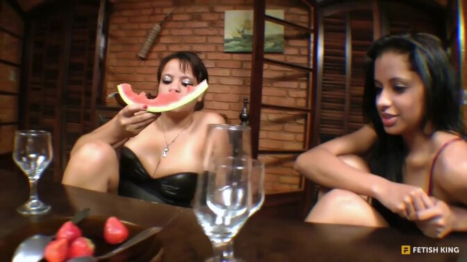 Two sexy babes engage in golden shower fun