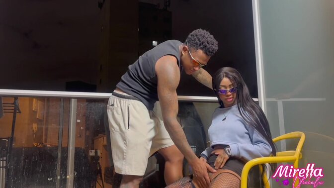 Well-endowed black man fucks skinny young girl in a porch chair.