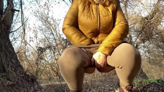 Wet pussy of a mature milf squatting and peeing