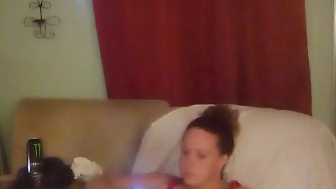 White girl with long brunette hair teases in panties while playing video games