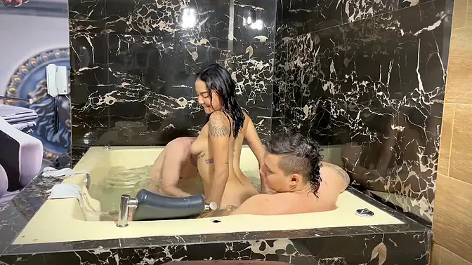 Young Latina slut rides and sucks two big cocks in the jacuzzi